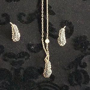 Swarovski 16” adjustable rose gold feather necklace and matching earrings.
